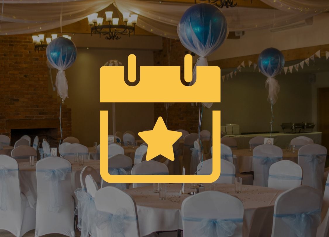 Professionally decorated event hall with blue balloons and white-covered chairs, showcasing Hellamaid USA’s expert cleaning services for special occasions.