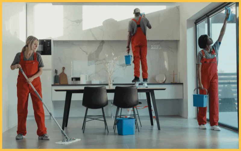 Group of People Cleaning a Dining room