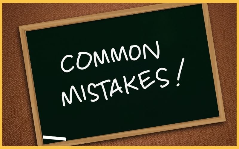 A chalkboard with the words "COMMON MISTAKES!" written in white chalk, framed against a textured brown background.