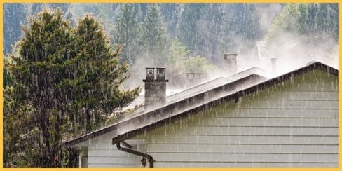 Raindrops falling on the roof of a house.